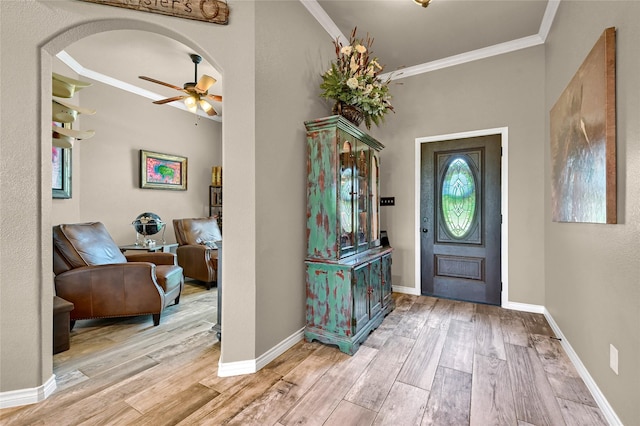 489 Roberts Run, Sherman, TX 75092 - entrance foyer with ornamental molding, a ceiling fan, wood finished floors, baseboards, and arched walkways