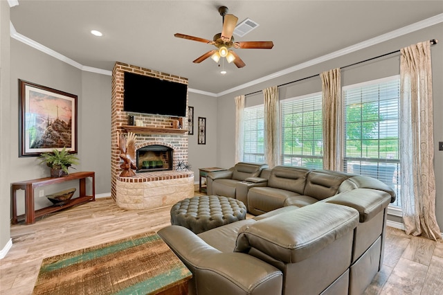 489 Roberts Run, Sherman, TX 75092 - living area featuring a ceiling fan, baseboards, light wood-style flooring, healthy amount of natural light, and ornamental molding