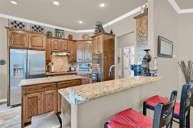 489 Roberts Run, Sherman, TX 75092 - kitchen featuring appliances with stainless steel finishes, ornamental molding, a peninsula, decorative backsplash, and light stone counters