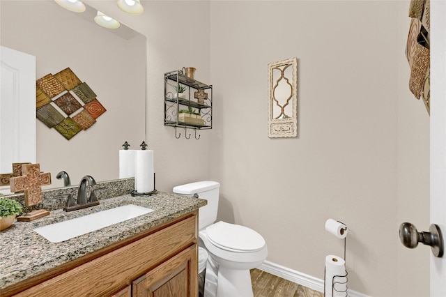 489 Roberts Run, Sherman, TX 75092 - half bath with toilet, vanity, wood finished floors, and baseboards