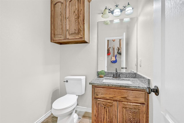 489 Roberts Run, Sherman, TX 75092 - bathroom with toilet, vanity, and baseboards
