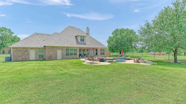 489 Roberts Run, Sherman, TX 75092 - back of property featuring a chimney, brick siding, a patio, and a fire pit