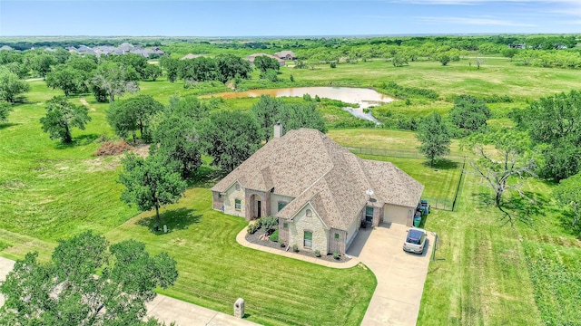 489 Roberts Run, Sherman, TX 75092 - aerial view of property and surrounding area with a tree filled landscape and a nearby body of water