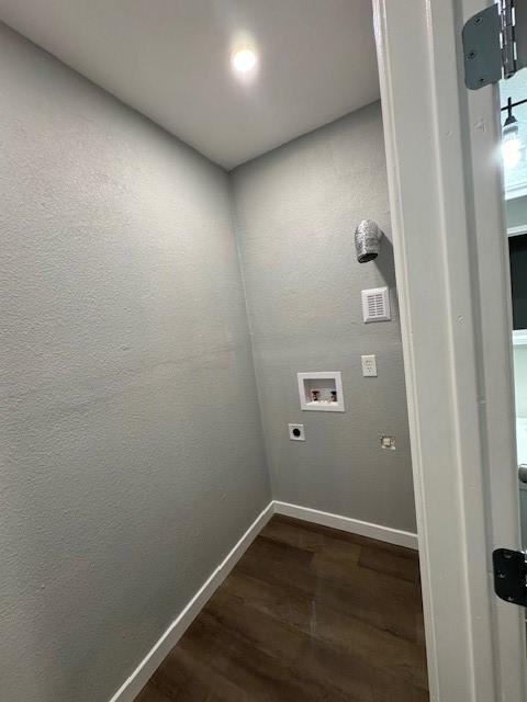 1511 Gurley Ave, Waco, TX 76706 - laundry area with washer hookup, dark wood-type flooring, baseboards, and electric dryer hookup