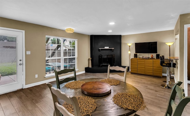 8910 Deerwood Dr, Rowlett, TX 75088 - dining space with light wood-style floors, baseboards, and recessed lighting