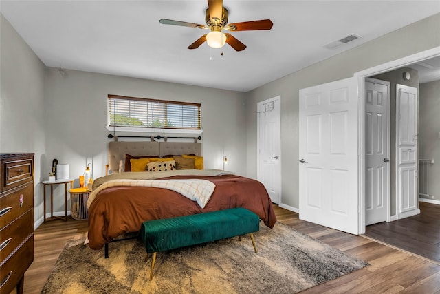 8910 Deerwood Dr, Rowlett, TX 75088 - bedroom featuring wood finished floors, baseboards, and a ceiling fan