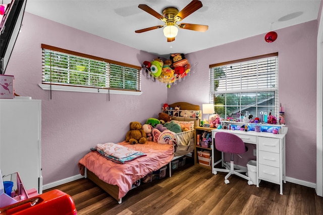 8910 Deerwood Dr, Rowlett, TX 75088 - bedroom featuring wood finished floors, a textured wall, baseboards, and a ceiling fan
