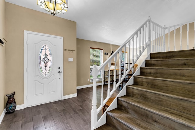 8910 Deerwood Dr, Rowlett, TX 75088 - entrance foyer with stairway, baseboards, and wood finished floors