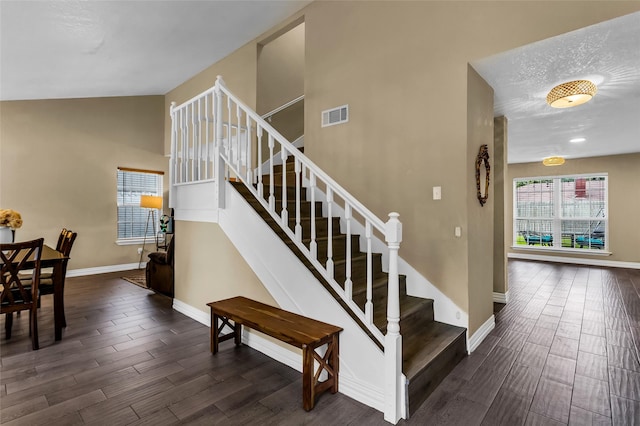 8910 Deerwood Dr, Rowlett, TX 75088 - stairway with wood finished floors and baseboards