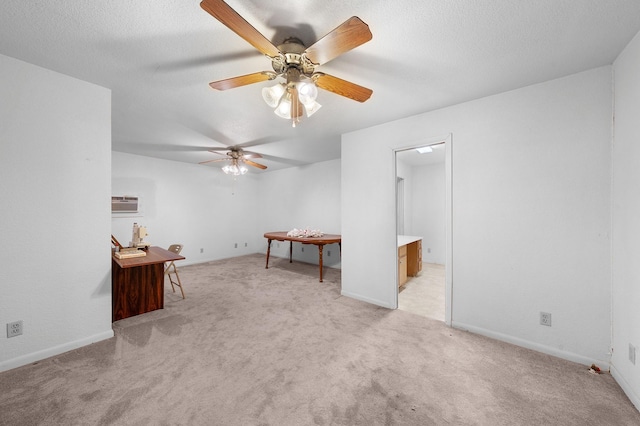 104 W Oak St, Yantis, TX 75497 - spare room with light colored carpet, a ceiling fan, a wall mounted air conditioner, and baseboards
