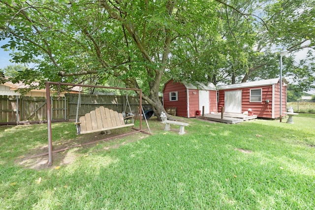 104 W Oak St, Yantis, TX 75497 - back of property featuring an outdoor structure and a wooden deck