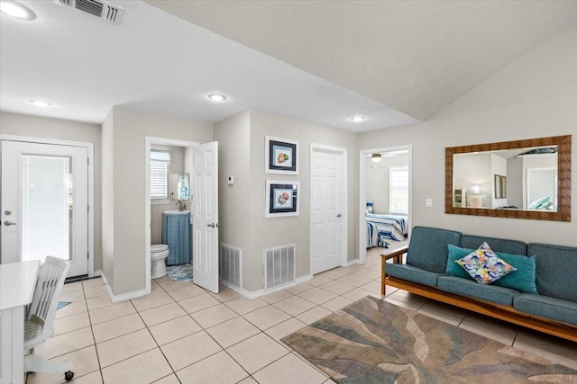 970 Gulfview Dr, Crystal Beach, TX 77650 - living room with plenty of natural light, baseboards, light tile patterned floors, and recessed lighting