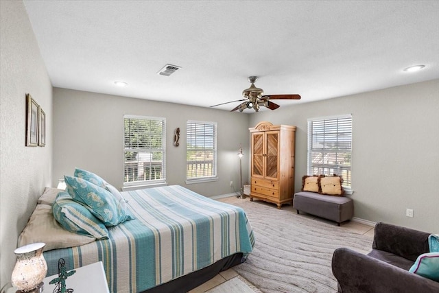 970 Gulfview Dr, Crystal Beach, TX 77650 - bedroom featuring baseboards, a ceiling fan, and light carpet