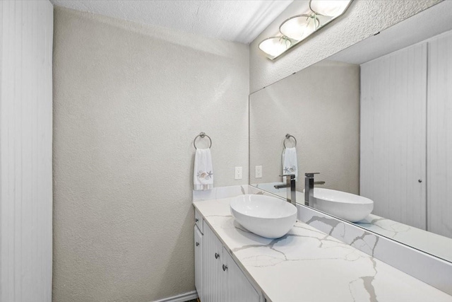 970 Gulfview Dr, Crystal Beach, TX 77650 - bathroom with vanity and a textured wall