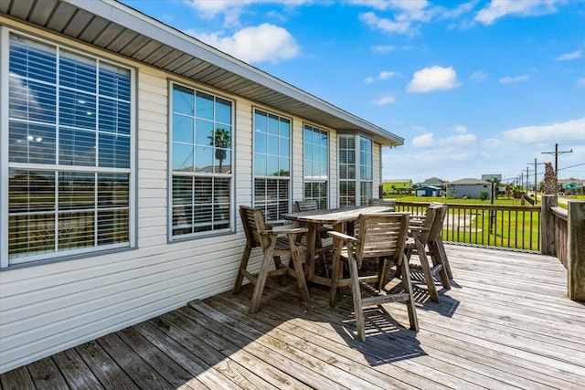 970 Gulfview Dr, Crystal Beach, TX 77650 - wooden terrace with outdoor dining space