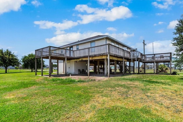 970 Gulfview Dr, Crystal Beach, TX 77650 - back of property with a wooden deck and a lawn