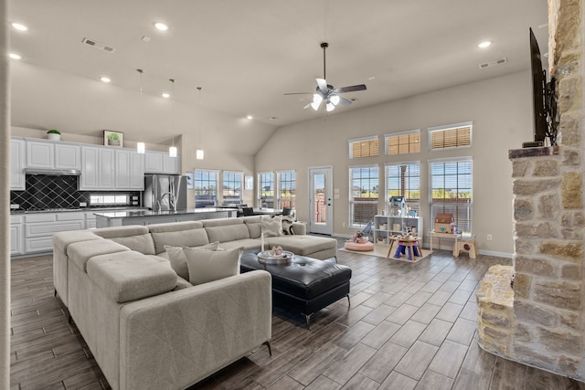 9212 Brittlebrush Trl, Fort Worth, TX 76177 - living area with a ceiling fan, high vaulted ceiling, recessed lighting, dark wood-type flooring, and plenty of natural light