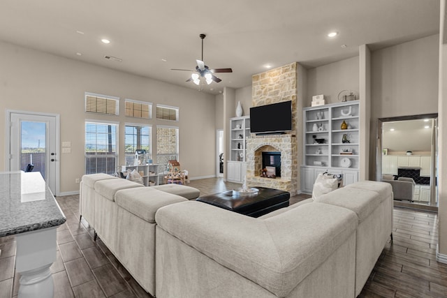 9212 Brittlebrush Trl, Fort Worth, TX 76177 - living area with a fireplace, a ceiling fan, dark wood finished floors, baseboards, and recessed lighting
