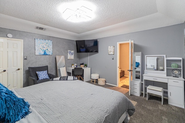 1501 Raintree Ct, Grand Prairie, TX 75050 - carpeted bedroom featuring a textured ceiling, a desk, and baseboards