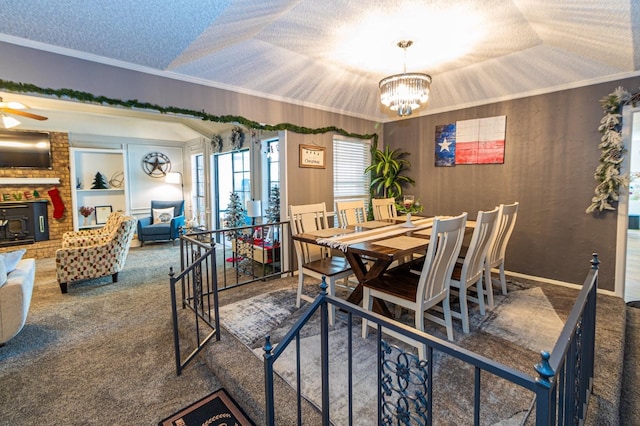 1501 Raintree Ct, Grand Prairie, TX 75050 - dining room featuring carpet, a chandelier, crown molding, a ceiling fan, and a textured ceiling