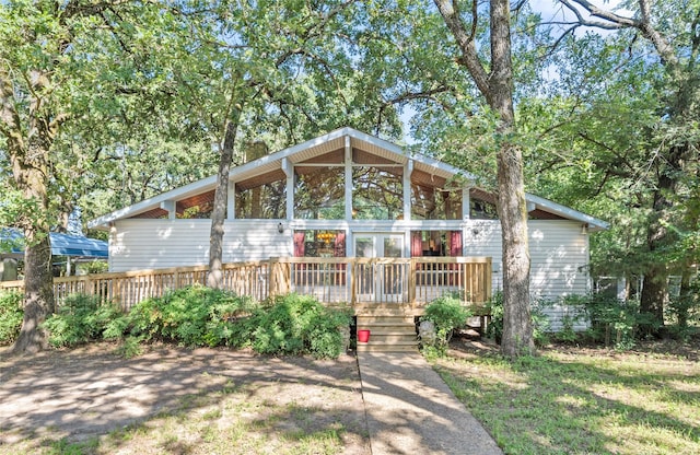 9598 Brockrim Ln, Quinlan, TX 75474 - view of front facade featuring a wooden deck and french doors