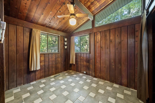 9598 Brockrim Ln, Quinlan, TX 75474 - spare room with wood ceiling, wood walls, and ceiling fan