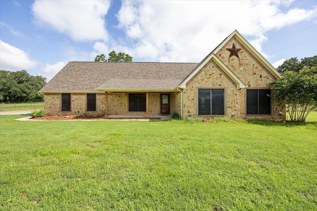 1511 Cabaniss Ln, Weatherford, TX 76088 - view of front of house with a front lawn, stone siding, and roof with shingles