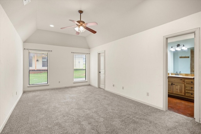 1511 Cabaniss Ln, Weatherford, TX 76088 - unfurnished bedroom featuring carpet flooring, vaulted ceiling, a sink, baseboards, and ensuite bath