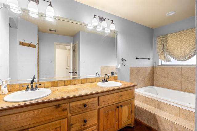 1511 Cabaniss Ln, Weatherford, TX 76088 - full bathroom featuring double vanity and a garden tub