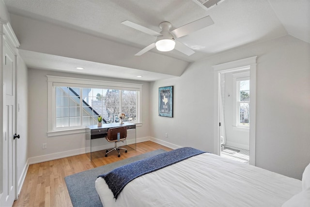 435 Allison Dr, Dallas, TX 75208 - bedroom featuring wood finished floors, multiple windows, baseboards, and vaulted ceiling