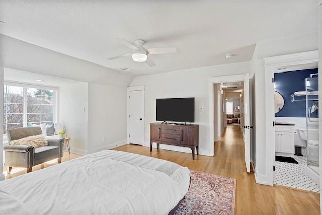435 Allison Dr, Dallas, TX 75208 - bedroom featuring light wood-style floors, baseboards, vaulted ceiling, a ceiling fan, and connected bathroom