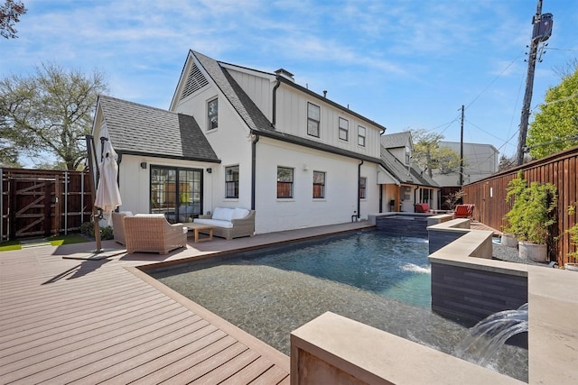 435 Allison Dr, Dallas, TX 75208 - back of property featuring a deck, an outdoor hangout area, a fenced backyard, and a pool with connected hot tub