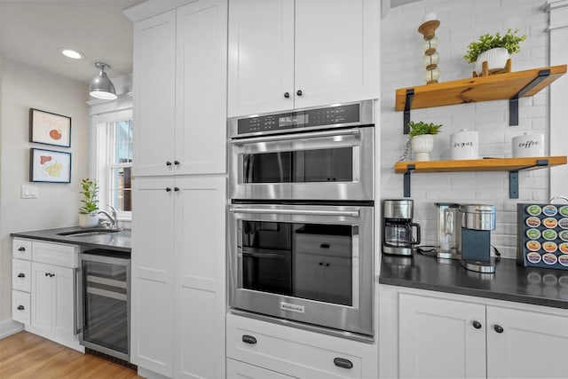 435 Allison Dr, Dallas, TX 75208 - kitchen featuring beverage cooler, stainless steel double oven, open shelves, backsplash, and dark countertops