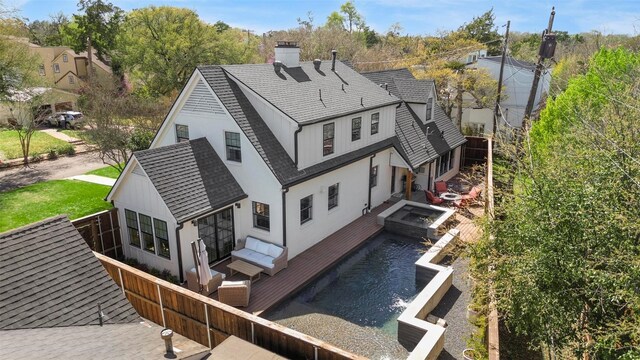 435 Allison Dr, Dallas, TX 75208 - rear view of property featuring a shingled roof and a chimney