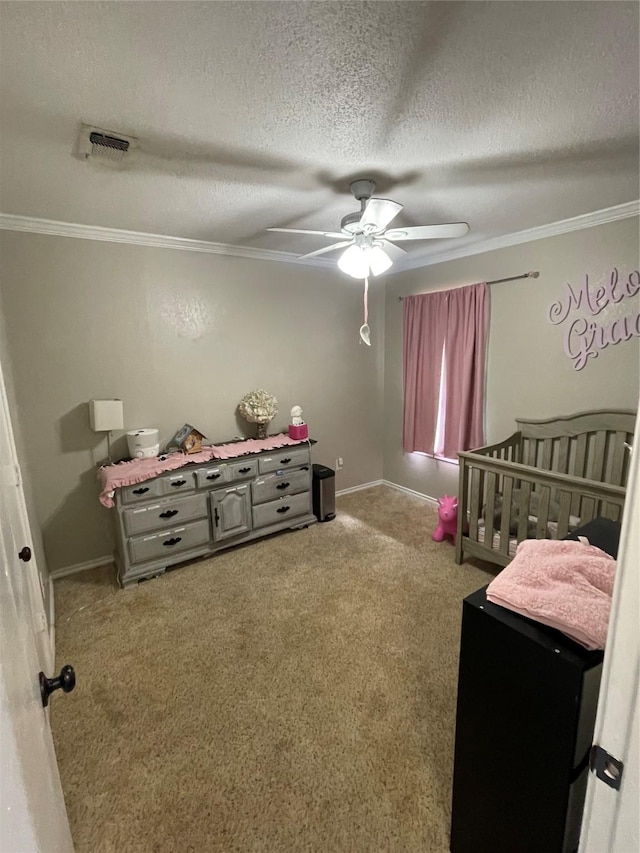 322 Cherry St, Weatherford, TX 76086 - bedroom featuring carpet flooring, crown molding, a ceiling fan, a textured ceiling, and baseboards