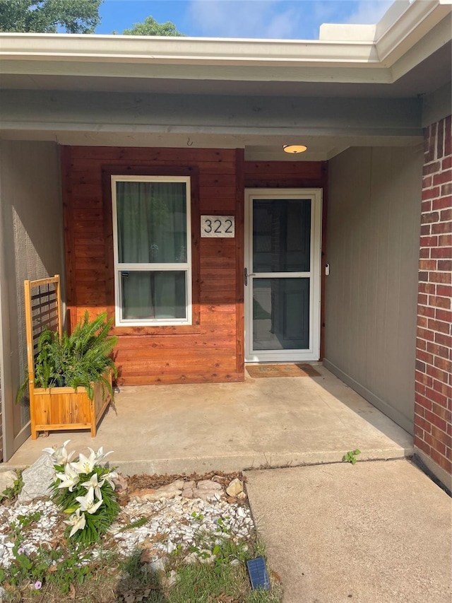 322 Cherry St, Weatherford, TX 76086 - view of exterior entry featuring a porch