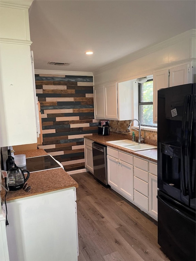 322 Cherry St, Weatherford, TX 76086 - kitchen featuring black fridge with ice dispenser, a sink, dishwasher, crown molding, and white cabinetry