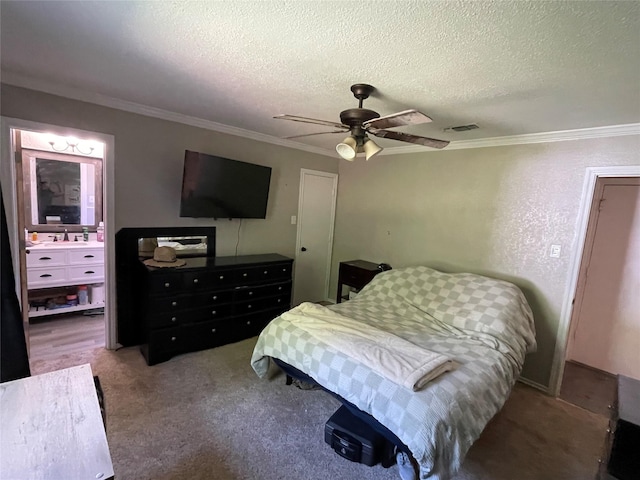 322 Cherry St, Weatherford, TX 76086 - bedroom featuring ornamental molding, a textured ceiling, a sink, a ceiling fan, and carpet