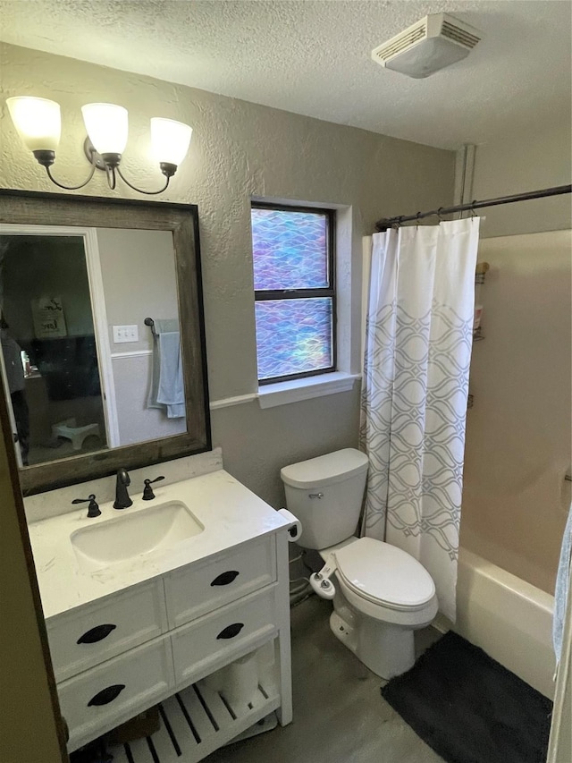 322 Cherry St, Weatherford, TX 76086 - bathroom featuring vanity, toilet, a textured ceiling, shower / bath combination with curtain, and a textured wall