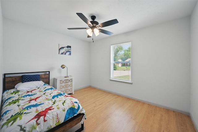7201 Harwick Ln, North Richland Hills, TX 76182 - bedroom featuring wood finished floors, baseboards, and ceiling fan