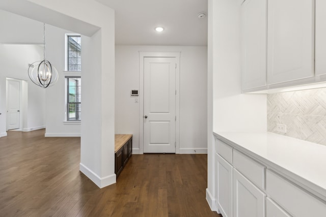 16431 Elk Hollow Rd, Frisco, TX 75035 - corridor with a chandelier, baseboards, dark wood-style flooring, and recessed lighting