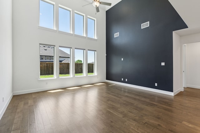 16431 Elk Hollow Rd, Frisco, TX 75035 - empty room featuring a high ceiling, ceiling fan, wood finished floors, and baseboards