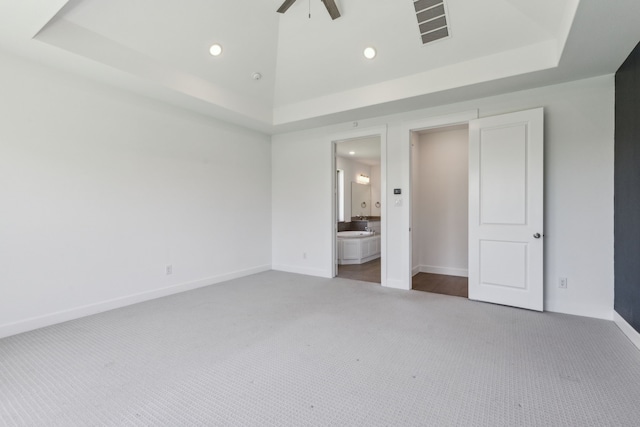 16431 Elk Hollow Rd, Frisco, TX 75035 - unfurnished bedroom with a tray ceiling, carpet, baseboards, recessed lighting, and ensuite bath