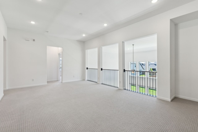 16431 Elk Hollow Rd, Frisco, TX 75035 - empty room featuring light carpet, recessed lighting, and baseboards