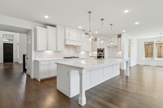 16431 Elk Hollow Rd, Frisco, TX 75035 - kitchen with backsplash, white cabinetry, light countertops, recessed lighting, and a spacious island