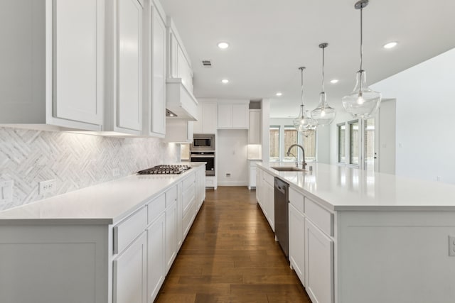 16431 Elk Hollow Rd, Frisco, TX 75035 - kitchen with appliances with stainless steel finishes, a sink, backsplash, white cabinets, and light countertops