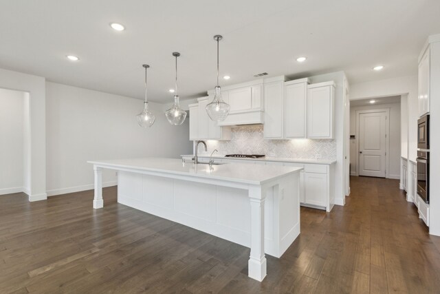 16431 Elk Hollow Rd, Frisco, TX 75035 - kitchen with stainless steel appliances, a sink, decorative backsplash, light countertops, and white cabinets