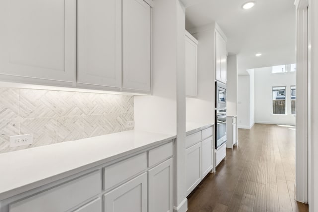 16431 Elk Hollow Rd, Frisco, TX 75035 - kitchen with stainless steel appliances, light countertops, white cabinetry, recessed lighting, and dark wood finished floors