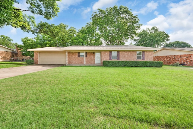 1804 Posey Ln, Sulphur Springs, TX 75482 - single story home featuring brick siding, an attached garage, concrete driveway, and a front yard