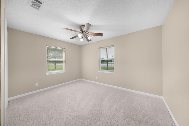 1804 Posey Ln, Sulphur Springs, TX 75482 - carpeted spare room with ceiling fan, baseboards, and a textured ceiling